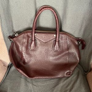 Wine leather purse in good shape a little wear and tear notes on handle